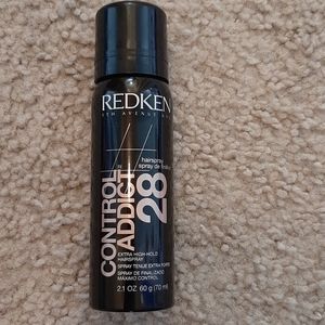 Extra hold hair.  Control addict 28 by Redken